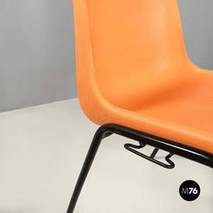 Stackable chairs in orange plastic and black metal, 2001