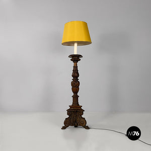 Carved wood and yellow fabric floor lamps or torch holders, 1500