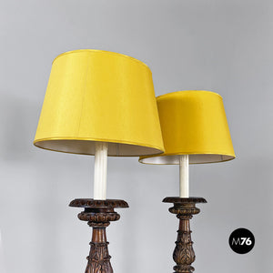 Carved wood and yellow fabric floor lamps or torch holders, 1500