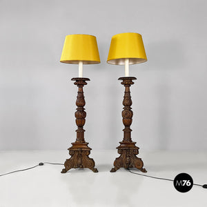 Carved wood and yellow fabric floor lamps or torch holders, 1500