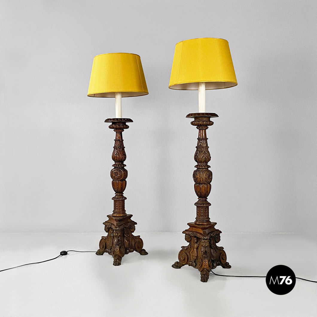 Carved wood and yellow fabric floor lamps or torch holders, 1500