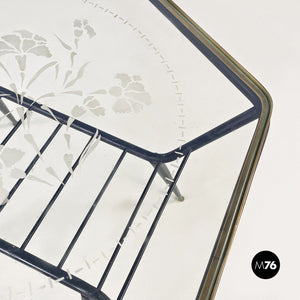 Decorated glass and metal coffee table with magazine rack, 1950s