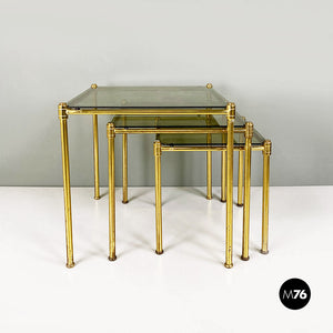 Brass and smoked glass trio of coffee tables, 1970s