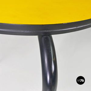 Round yellow laminate and black metal bar table, 1950s