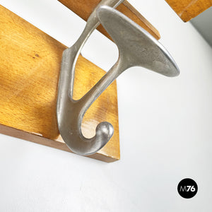 Wall hanger in polished wood and metal by Brevetti Reguitti, 1940s