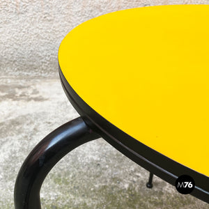 Round yellow laminate and black metal bar table, 1950s